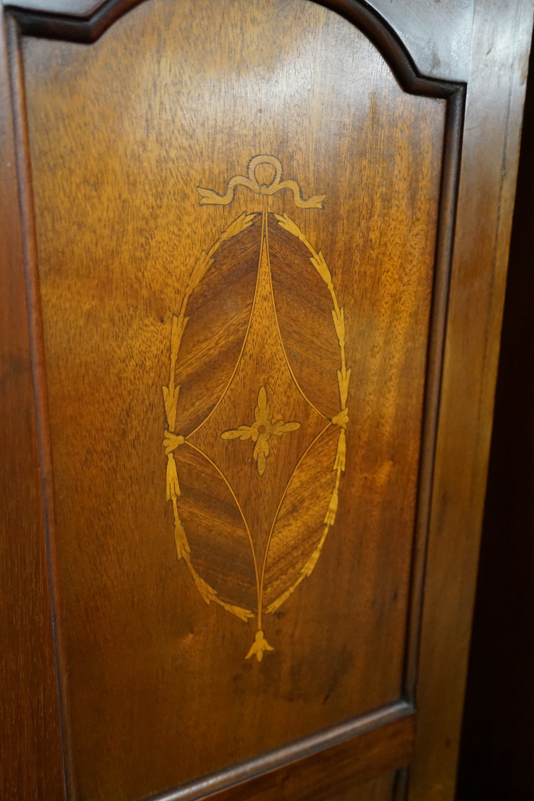 An Edwardian inlaid mahogany wardrobe, width 130cm, depth 50cm, height 200cm